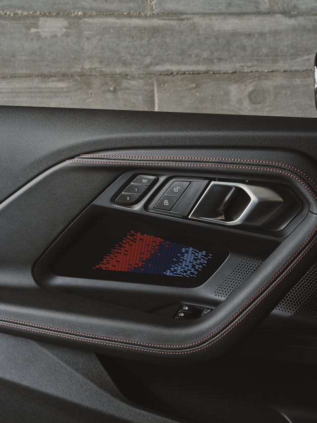 2025 BMW M2 interior door panel detail vertical