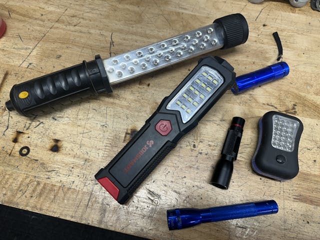 flashlight assortment on workbench