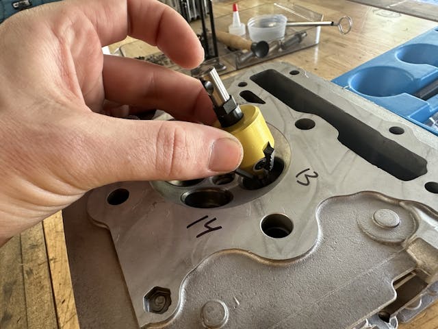 Placing neway valve seat cutter on pilot