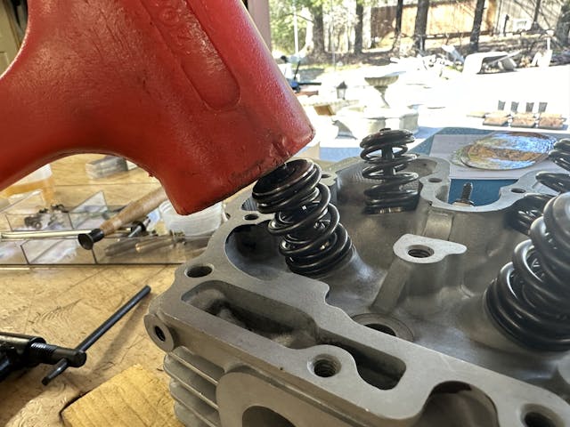 tapping valves with soft hammer to seat keepers