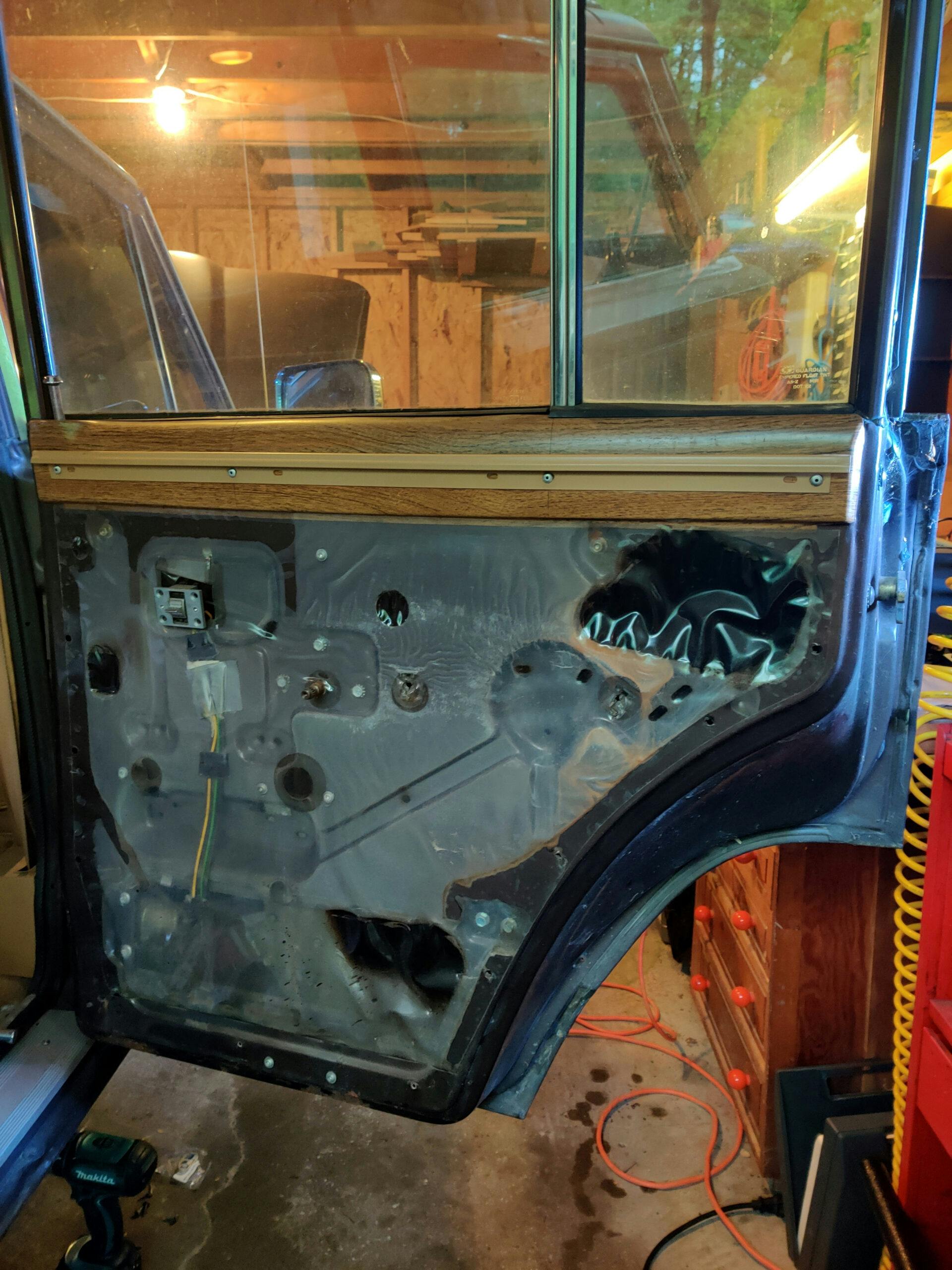 1987-Jeep-Grand-Wagoneer-Flex-Track-Install vapor barrier plastic