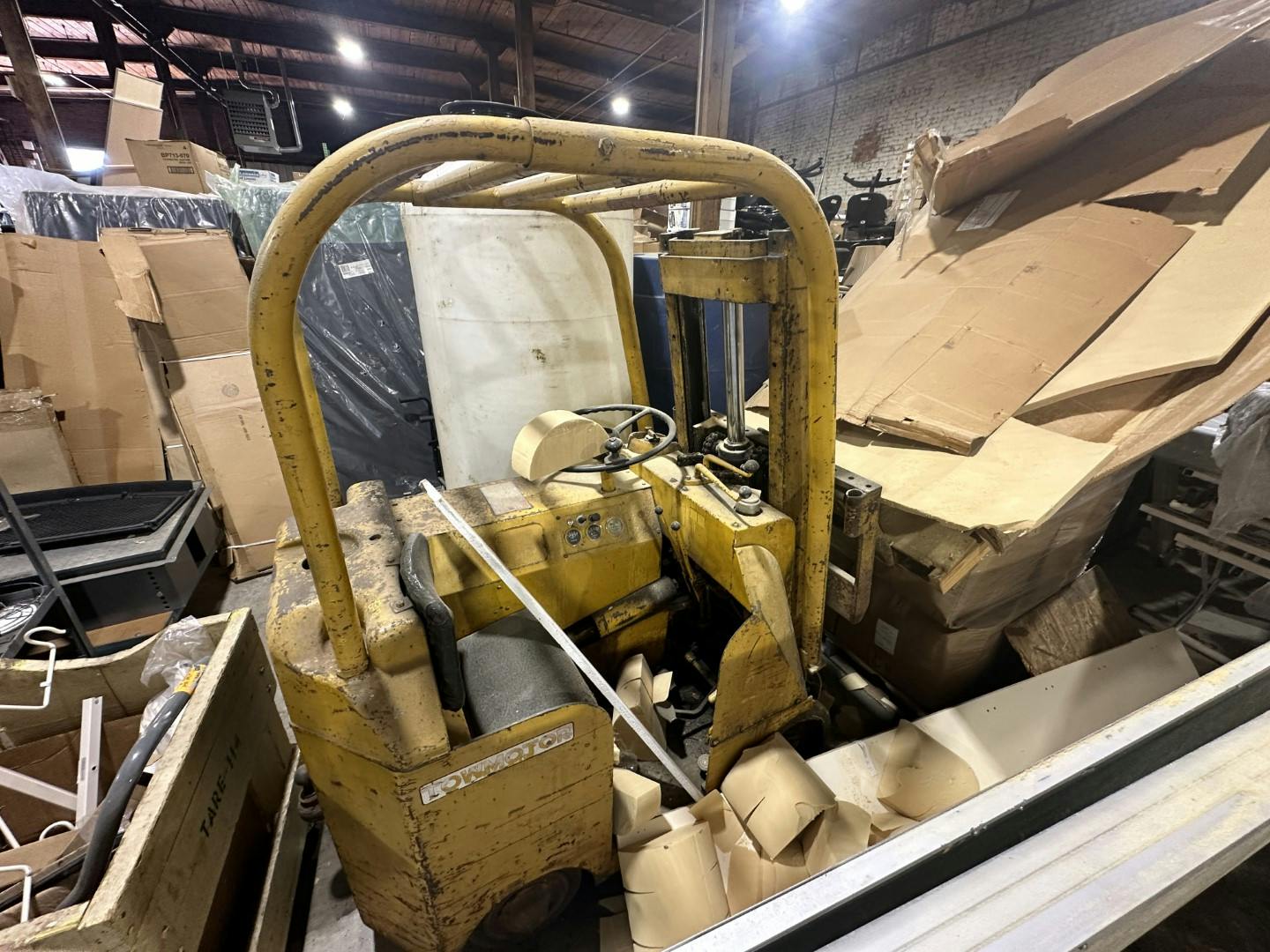 Factory forklift buried in stuff