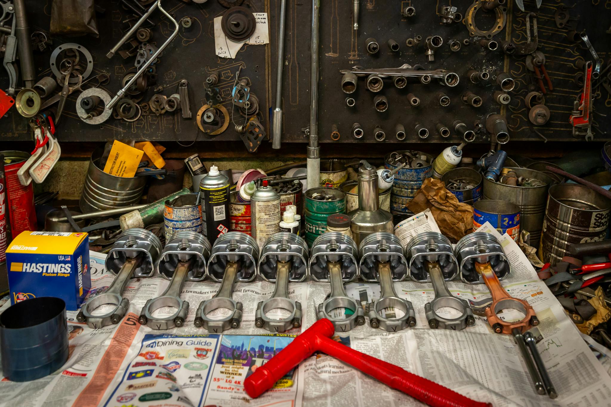 Leifert Auto Machine engine pistons on bench