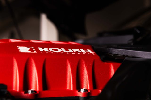 Roush 2024 Mustang GT Supercharger kit logo on red cover low angle