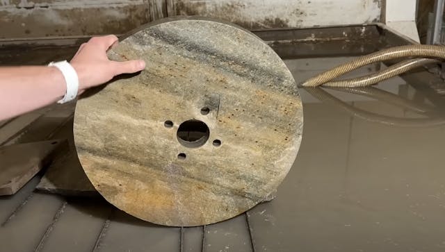 Stone wheels on a car experiment first stone wheel cut from waterjet