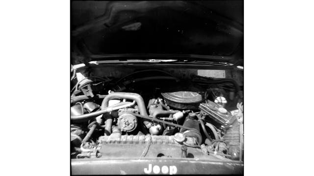 1984 Jeep Cherokee Chief engine bay black white vertical