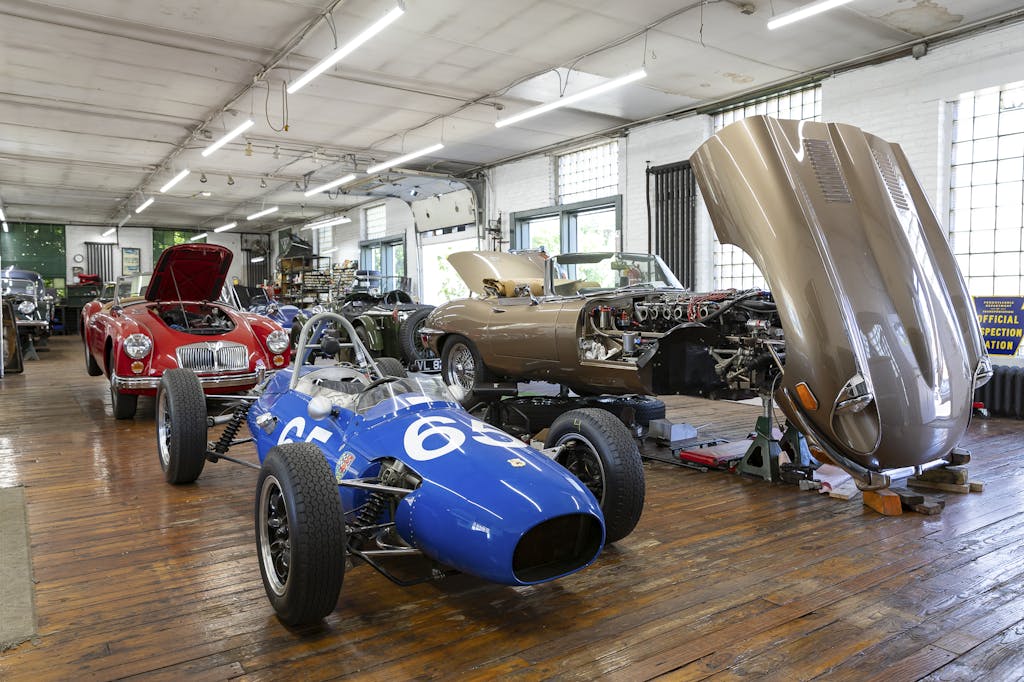 Ragtops & Roadsters classic car business shop interior race car with E-type