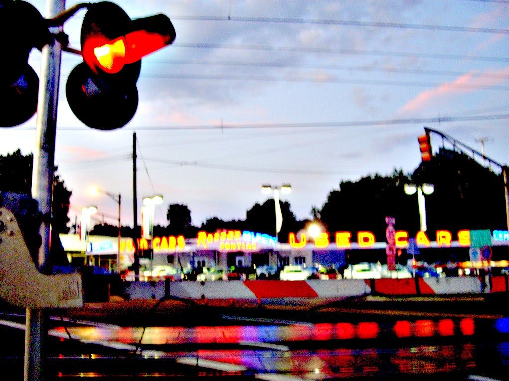 used car lot evening sky colors