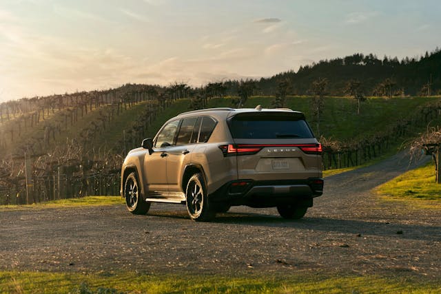 2025 Lexus LX 700h Overtrail exterior rear three quarter catching sunset light
