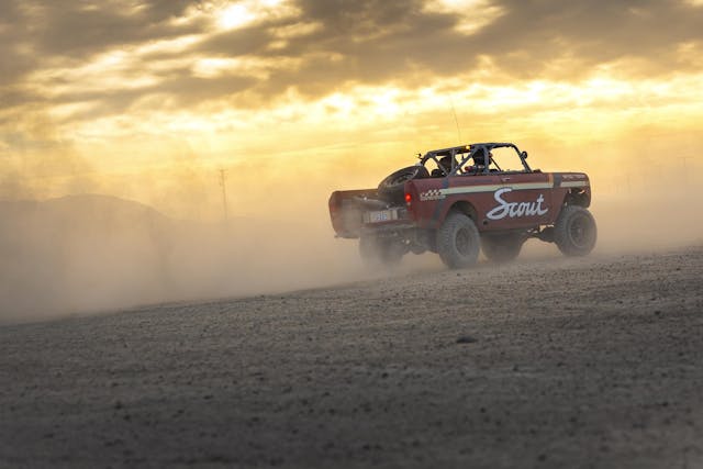 Race Terra Scout exterior rear three quarter driving with dust