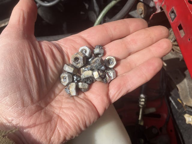 weld nuts in hand