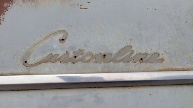 1952 Ford Customline Six Fordor Sedan badge impression