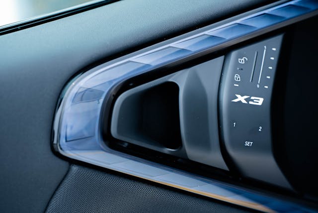2025 BMW X3 30 xDrive interior door handle and locking mechanism detail