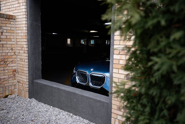 2025 BMW X3 30 xDrive exterior front end poking through garage