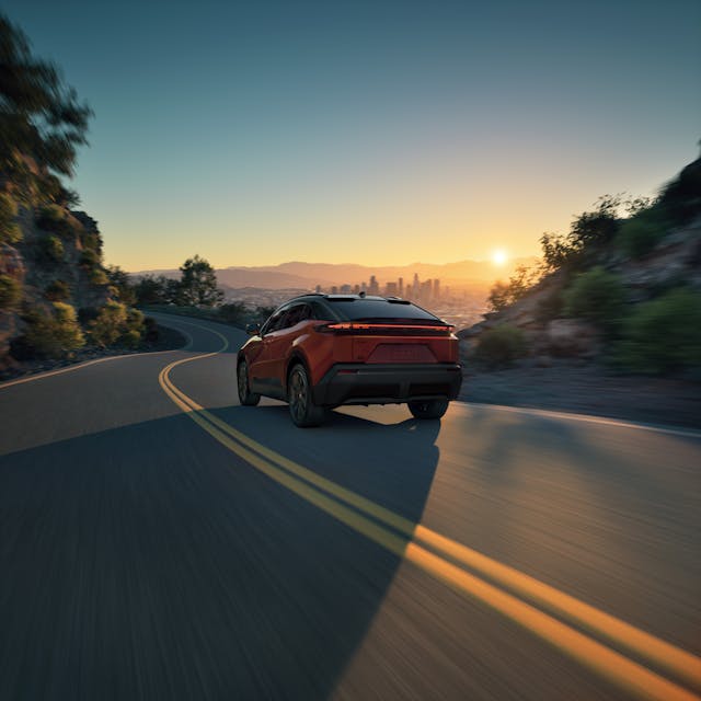 2026 Toyota C-HR exterior rear three quarter driving on road