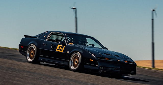 Hertel Trans Am GTA track car front three quarter dynamic track action