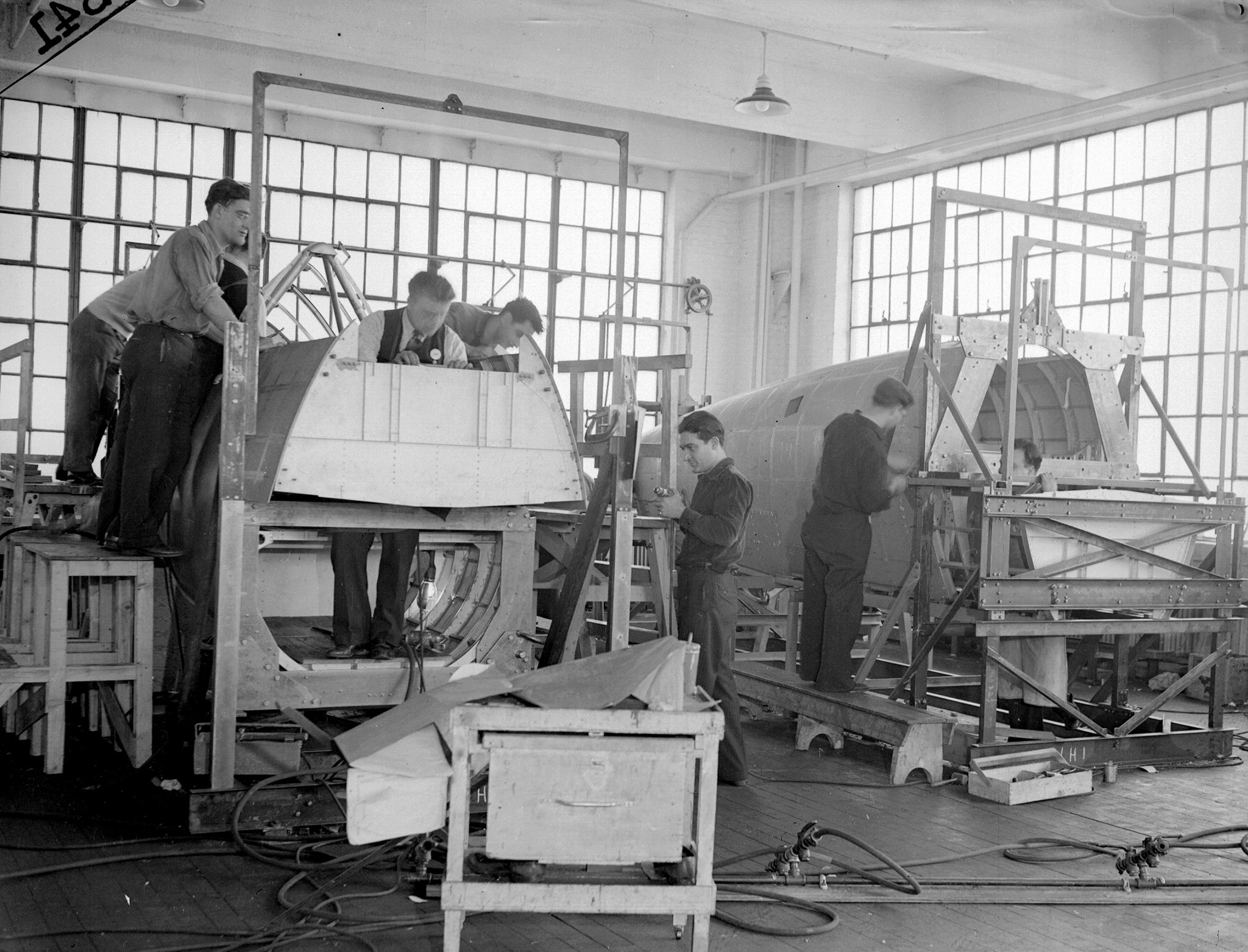 Workers building Navy planes at the Brewster Aeronautical Co