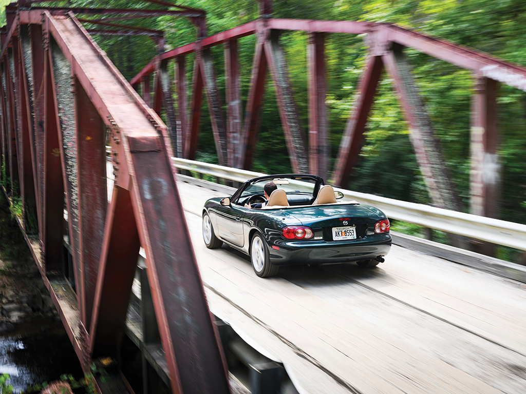 Mazda MX-5 Miata dynamic rear three quarter bridge crossing