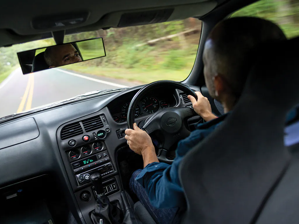Nissan Skyline GT-R interior driving action